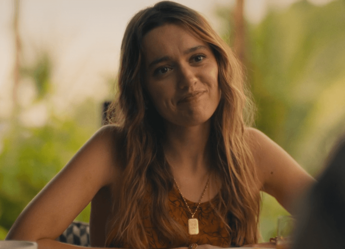 Chelsea's casual look from the first full day at the resort — a warm golden cami skimming her shoulders